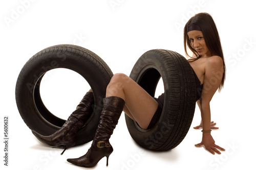 Photo: Young sexy girl with a car wheel Young sexy girl with a car wheel