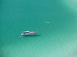 Boat over a crystalline turquoise beach in Arraial do Cabo