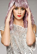 beautiful girl dressed for carnival wearing glossy pink wig 