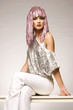 beautiful girl dressed for carnival wearing glossy pink wig 