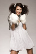 beautiful brunette winter girl wearing furry gloves 
