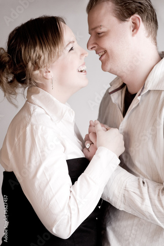 Photo: Portrait of a young loving couple having fun Portrait of a young loving couple having fun