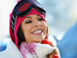 Portrait of a happy young girl snowboarding