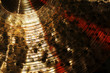 Detail of brass cymbal with red light reflections