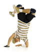 Young bboy standing on hands. Holding legs in air. 