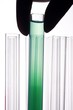Photo: A hand holding a test tube in plain background. A hand holding a test tube in plain background.
