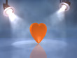 Orange heart on the foggy stage