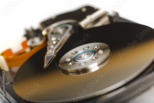 Modern opened hard disk drive over a white surface