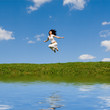 happy young woman is jumping