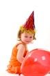 happy girl playing with colorful balloons