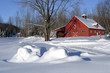 Red barn covered with fresh snow Red barn covered with fresh snow