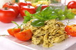 Spaghetti with pesto sauce and cheese