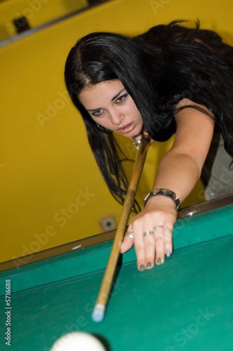 Photo: Sexy hot brunette female playing pool Sexy hot brunette female playing pool