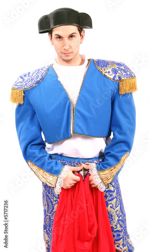 Photo: matador with his red cape and brave face ready for the bull matador with his red cape and brave face ready for the bull
