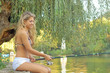 A beautiful young woman with a fishing pole A beautiful young woman with a fishing pole