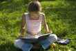 The girl draws on a meadow VI
