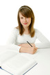 Portrait of Happy young schoolgirl reading book