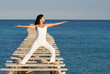 woman doing yoga or tai chi outdooors woman doing yoga or tai chi outdooors