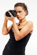Sexy girl with old photo camera taking a shoot. Sexy girl with old photo camera taking a shoot.
