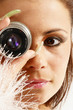 Sexy brown-eyed girl looking through the objective. Sexy brown-eyed girl looking through the objective.