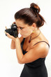 Sexy photographerl with old photo camera on the work. Sexy photographerl with old photo camera on the work.