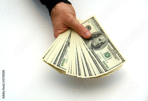 Photo: man holding large stack of hundred dollar bills fanned out man holding large stack of hundred dollar bills fanned out