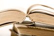Opened old book. White background. Sepia tone. Shallow DOF..