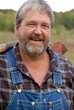 grey haired bearded farmer
