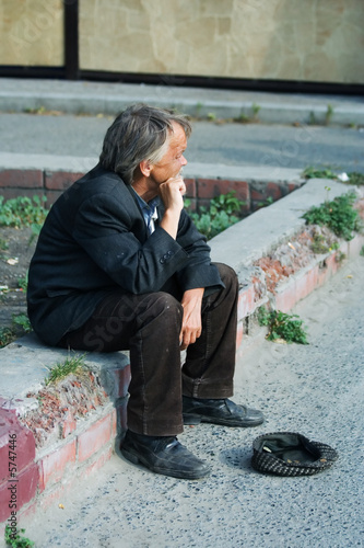 Homeless elderly beggar.