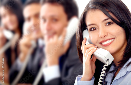 customer support team lead by a friendly girl smiling 
