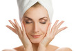 Beautiful young woman massaging her face