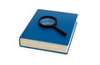 Blue book and magnifying glass on the white Blue book and magnifying glass on the white