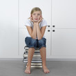teenage girl sitting on a ctack of books, dreaming about .... teenage girl sitting on a ctack of books, dreaming about ....