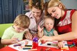 children painting with his mothers