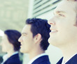 close-up shot of three business people standing 