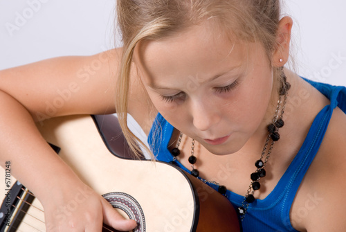 girl learning to play guitar girl learning to play guitar