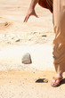 Man dropping  stone from  hand.  mercy, pardon, forgiveness