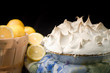 Basket of lemons with lemon meringue pie.