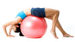 A slim young woman stretching over a fitball