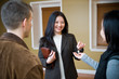 Photo: Realtor handling house key to new happy home owner Realtor handling house key to new happy home owner