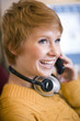 Foto: Woman on cell phone with headphones Woman on cell phone with headphones