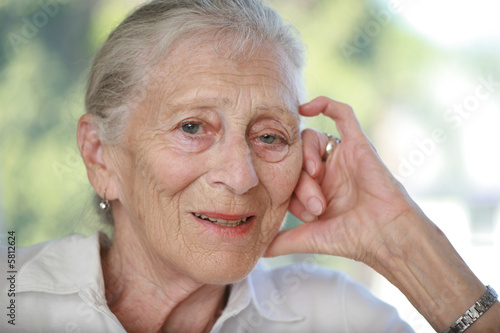 Close-up portrait of senior woman contemplating. Shallow DOF.
