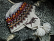 Knitted cap with a deer