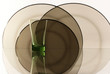 Photo: A glass beside a stack of white plates - on white background A glass beside a stack of white plates - on white background