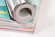 curled magazined on stack
