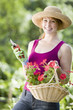 Foto: Smiling pretty woman gardener Smiling pretty woman gardener