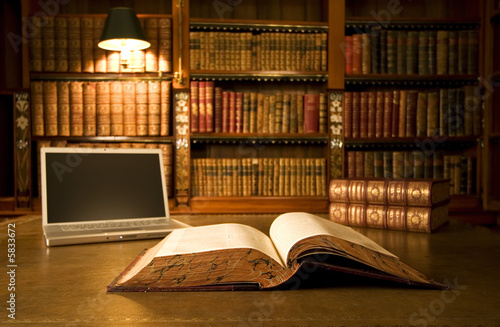 Photo: Laptop in classic library Laptop in classic library