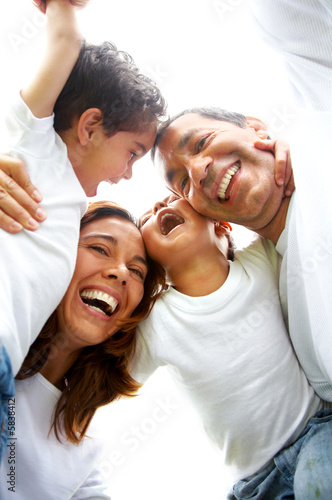 family lifestyle portrait of a mum and dad with their two kids 