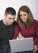 Young couple looking at a laptop computer together