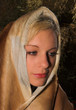 springbok animal skin is wrapped around a blonde lady